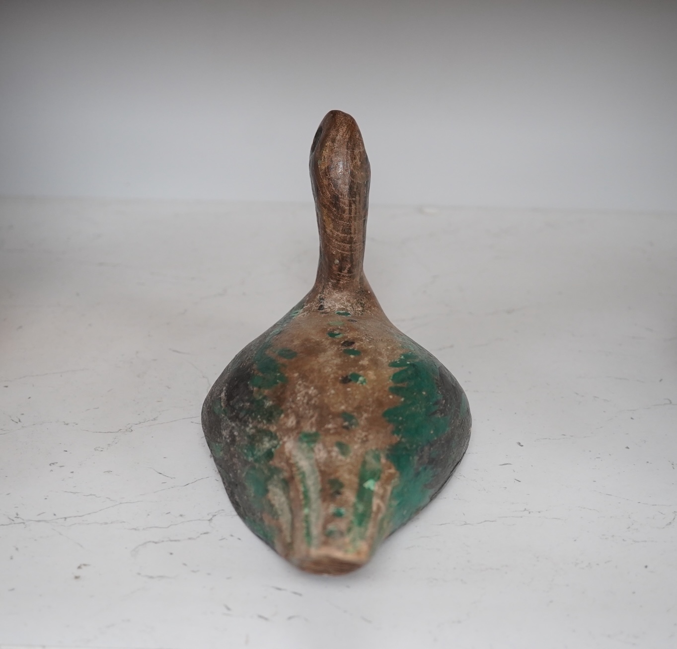 A 19th century painted decoy duck, 31cm long. Condition - worn